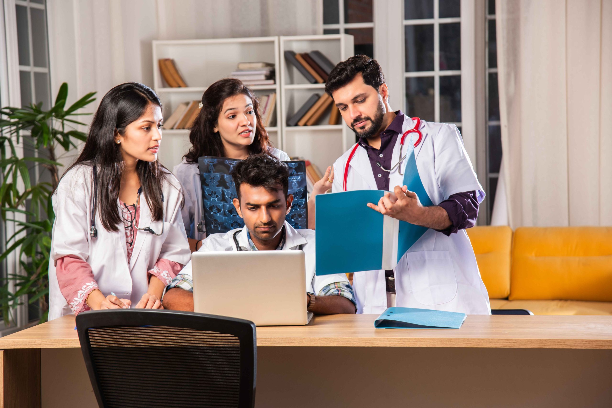 indian-asian-four-young-doctors-discussing-with-la-2025-01-16-13-05-15-utc_11zon